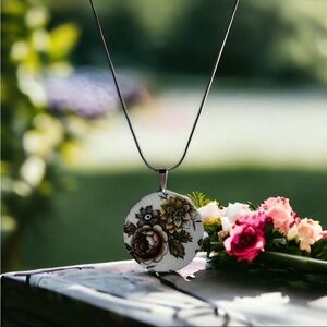 Artisan made broken china pendant.